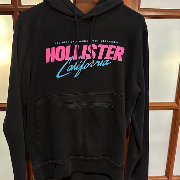 Hollister Sweaters - Hollister Black Hoodie with Pink and Blue Text